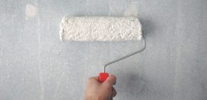 Paint roller on a wall