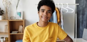 teenage boy in yellow shirt