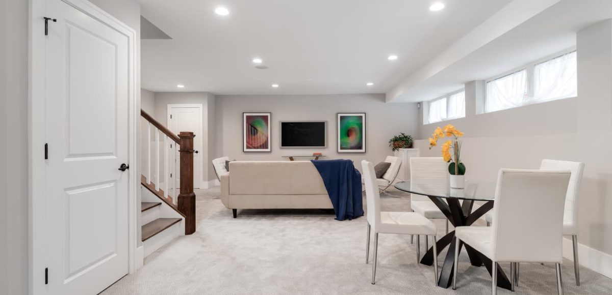 Beautifully designed white and cream-themed room in basement.