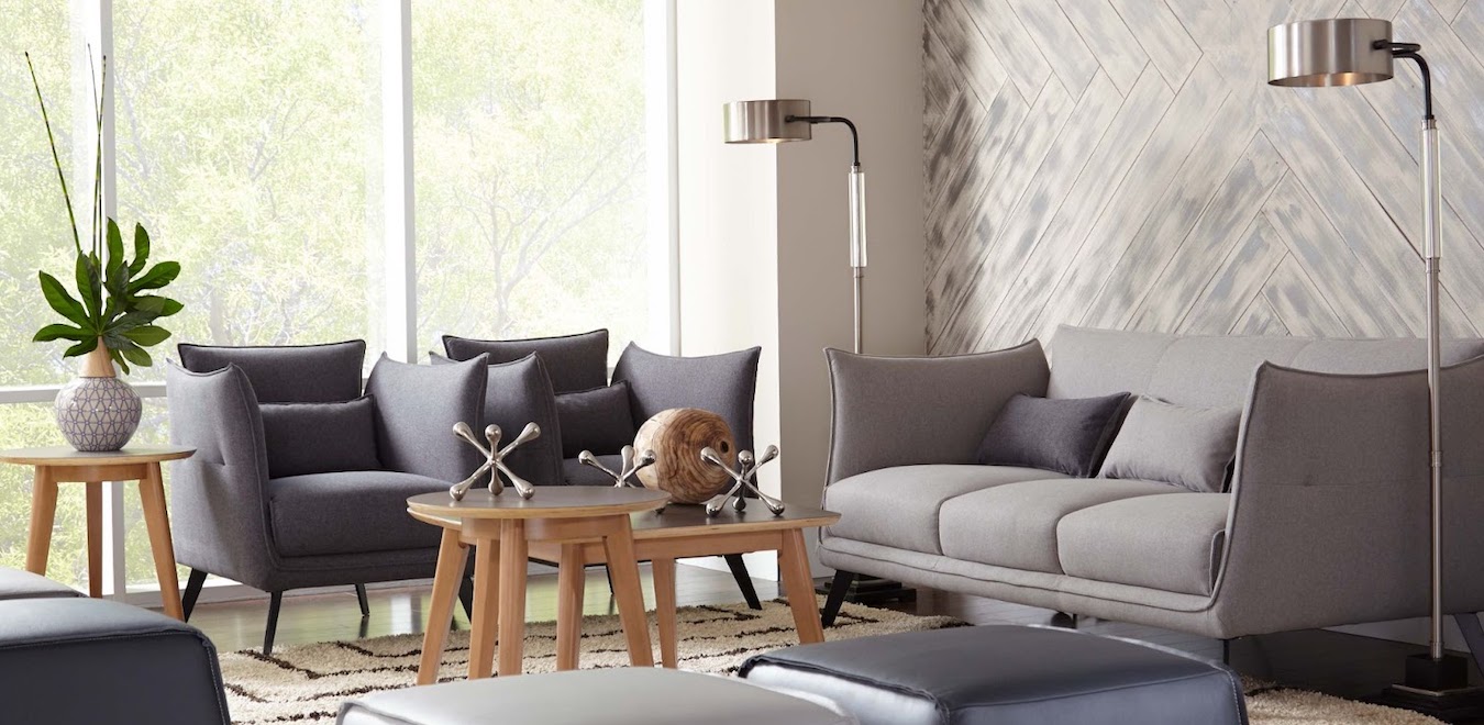 Modern farmhouse living room decorated in greys, warm woods, and silver metals.