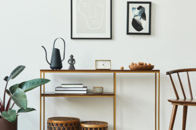 Modern entryway ideas with wall decor entryway, chair, coat rack, and console table.