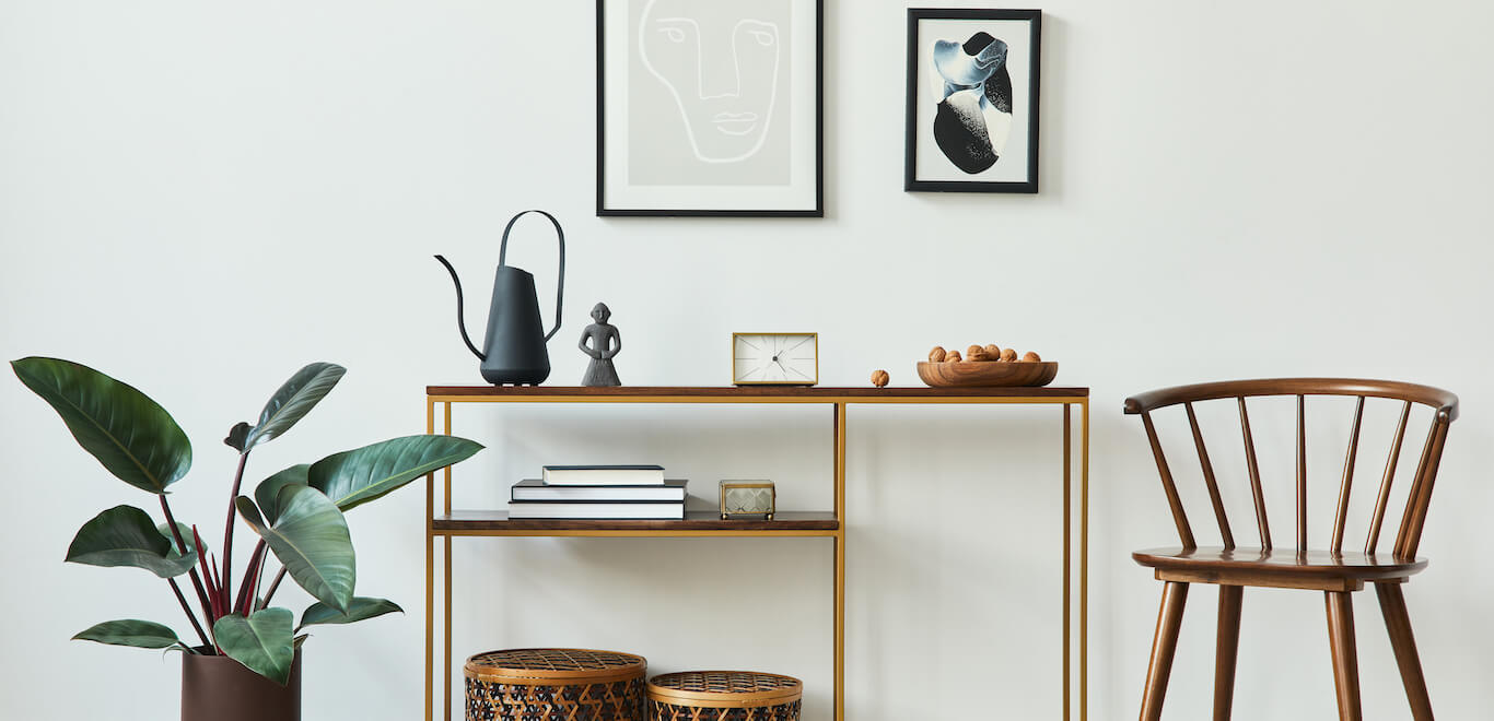 Modern entryway ideas with wall decor entryway, chair, coat rack, and console table.