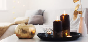 home decor with golden pumpkin and burning candles