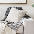 Textured layers interior styling of cushion sofa and throw in neutral colors good example of texture in interior design
