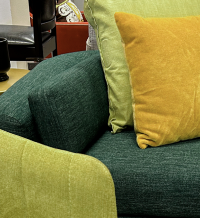 Holistic interior design instpired living room with shades of green, yellow, and cream to create a relaxing space.
