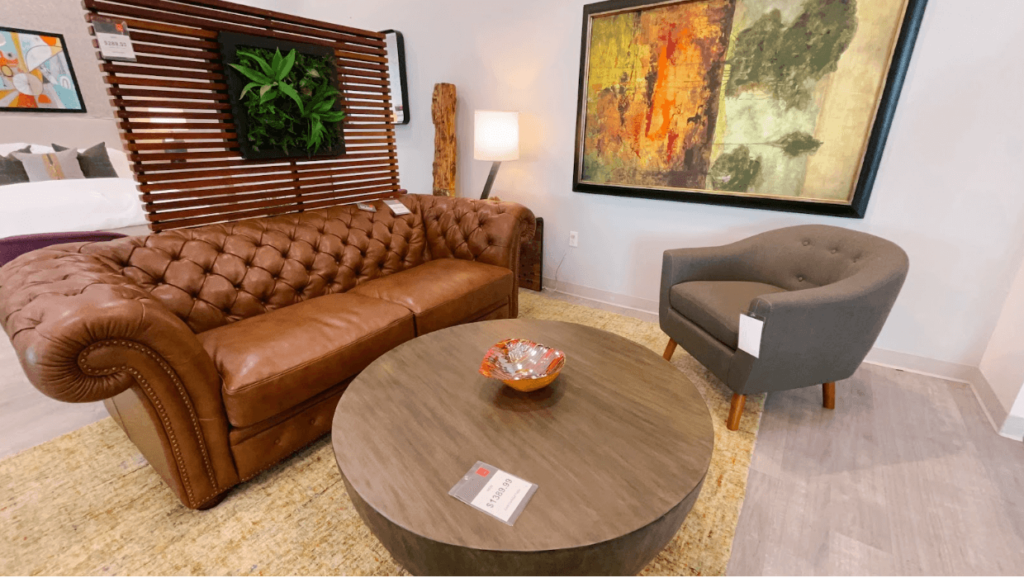 A living room set up including a brown leather sofa. 