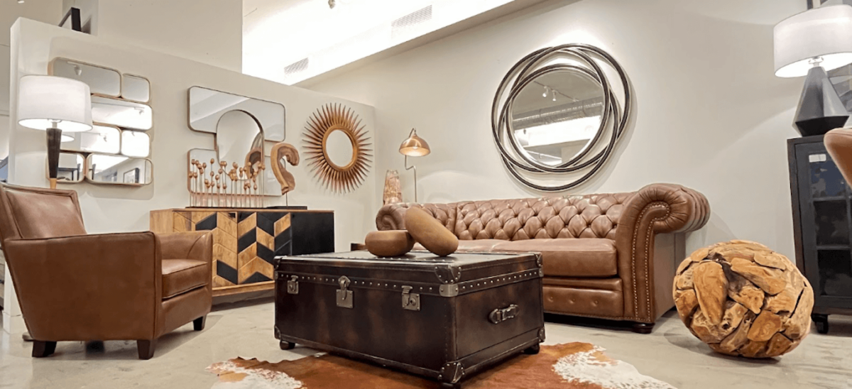A stylish brown leather sofa and chair in a living room