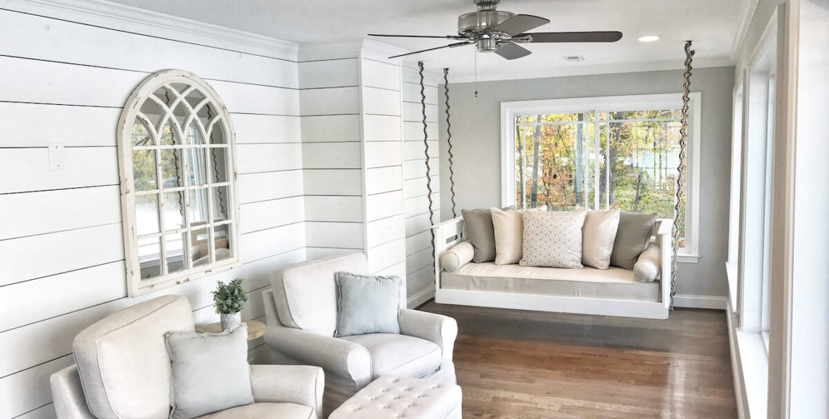 A bright room with white shiplap walls
