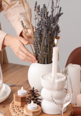 Modern french country interior design decorating with french country interiors and simple budget friendly french interior design style such as fresh lavender, wood dining table, accent candle holders for dining table, and everyday tablescape