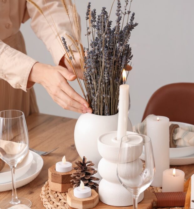 Modern french country interior design decorating with french country interiors and simple budget friendly french interior design style such as fresh lavender, wood dining table, accent candle holders for dining table, and everyday tablescape