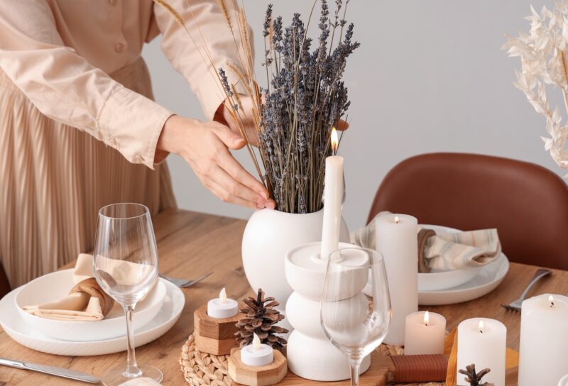 Modern french country interior design decorating with french country interiors and simple budget friendly french interior design style such as fresh lavender, wood dining table, accent candle holders for dining table, and everyday tablescape